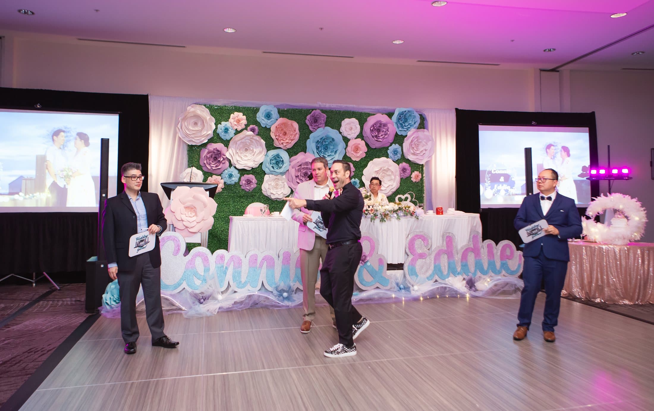 Vancouver event host running a crowd moment on the dance floor