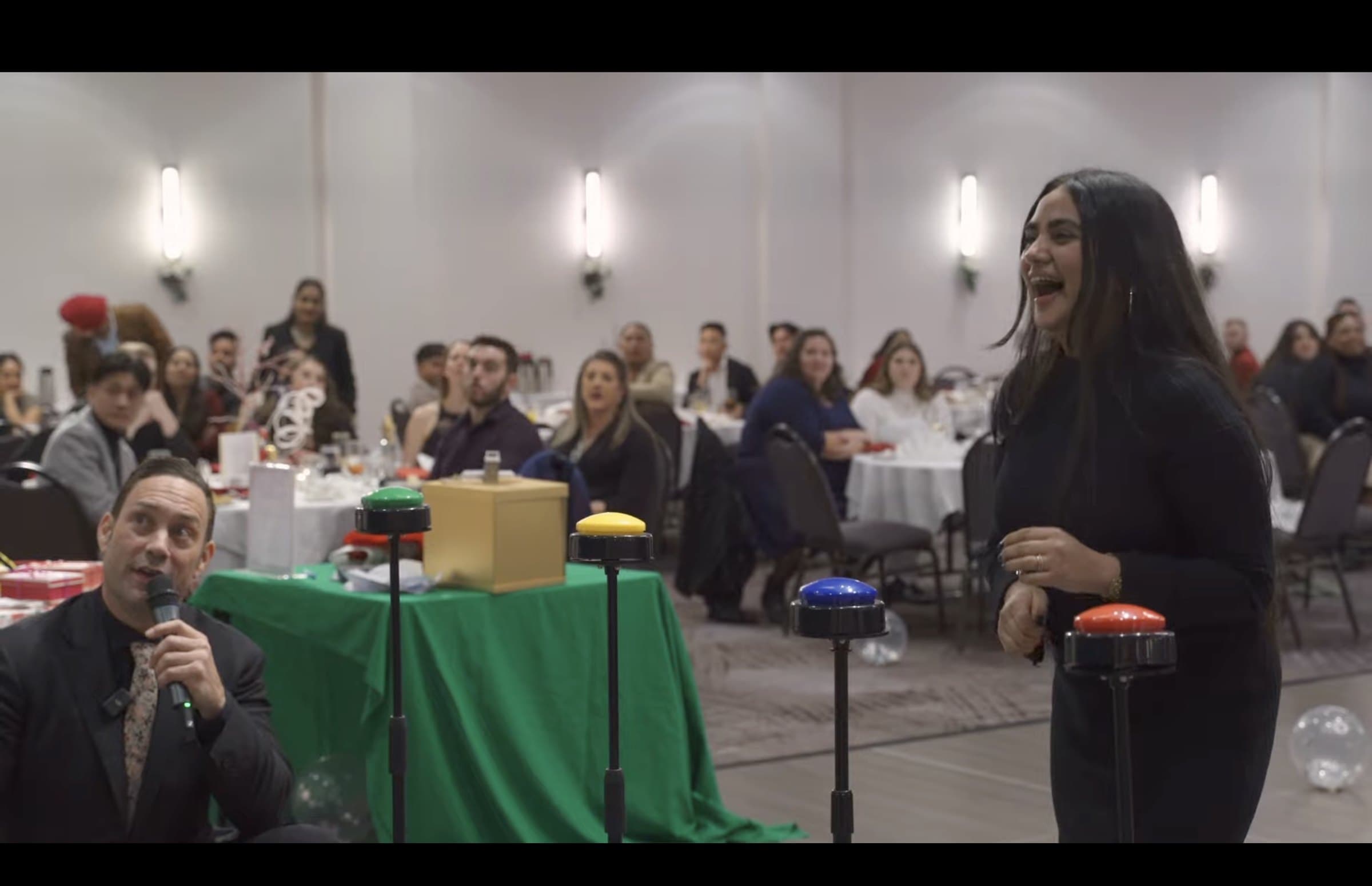 A full room watching a custom game show at a Vancouver event