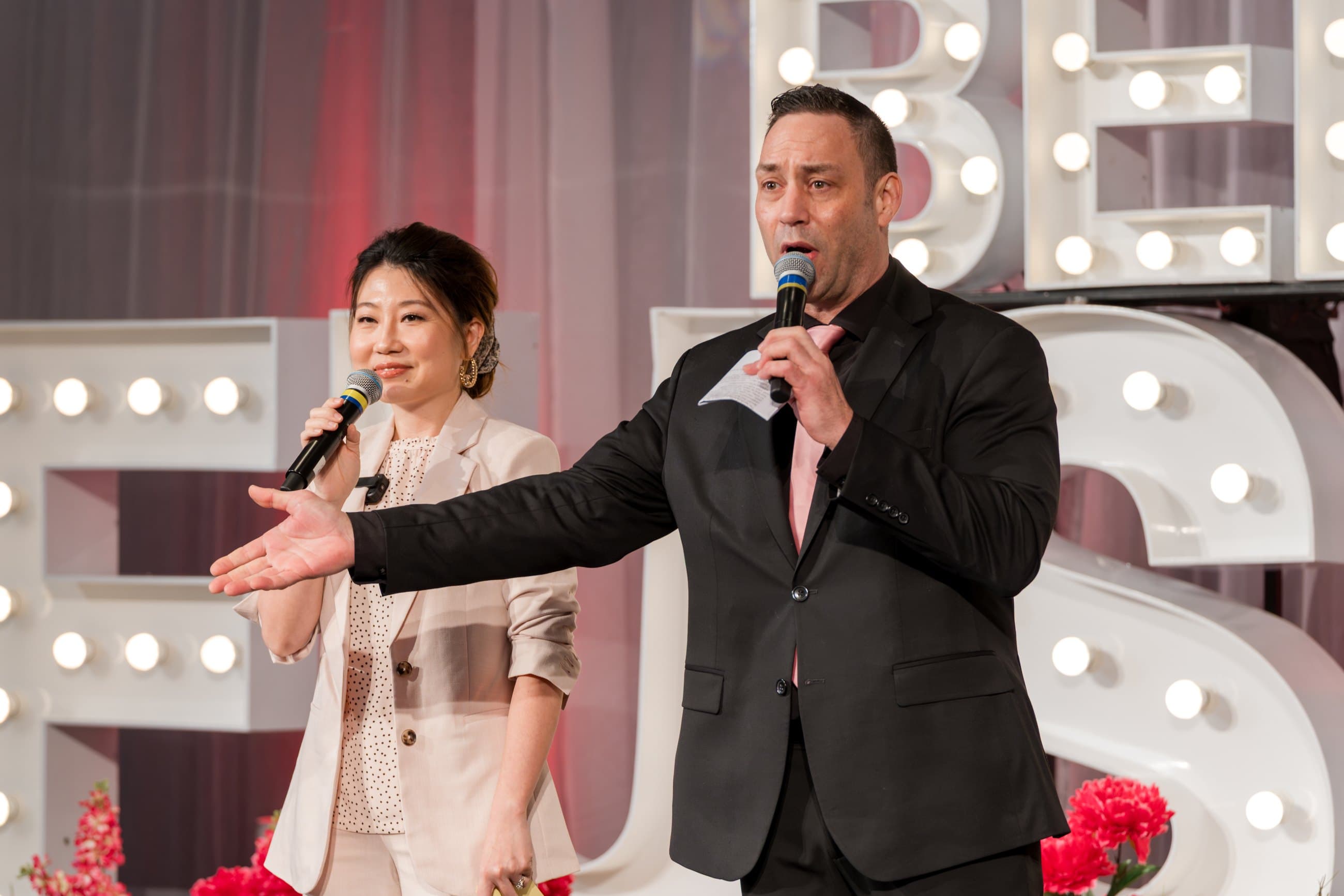 Mike Oulton co-hosting on stage at a Vancouver event
