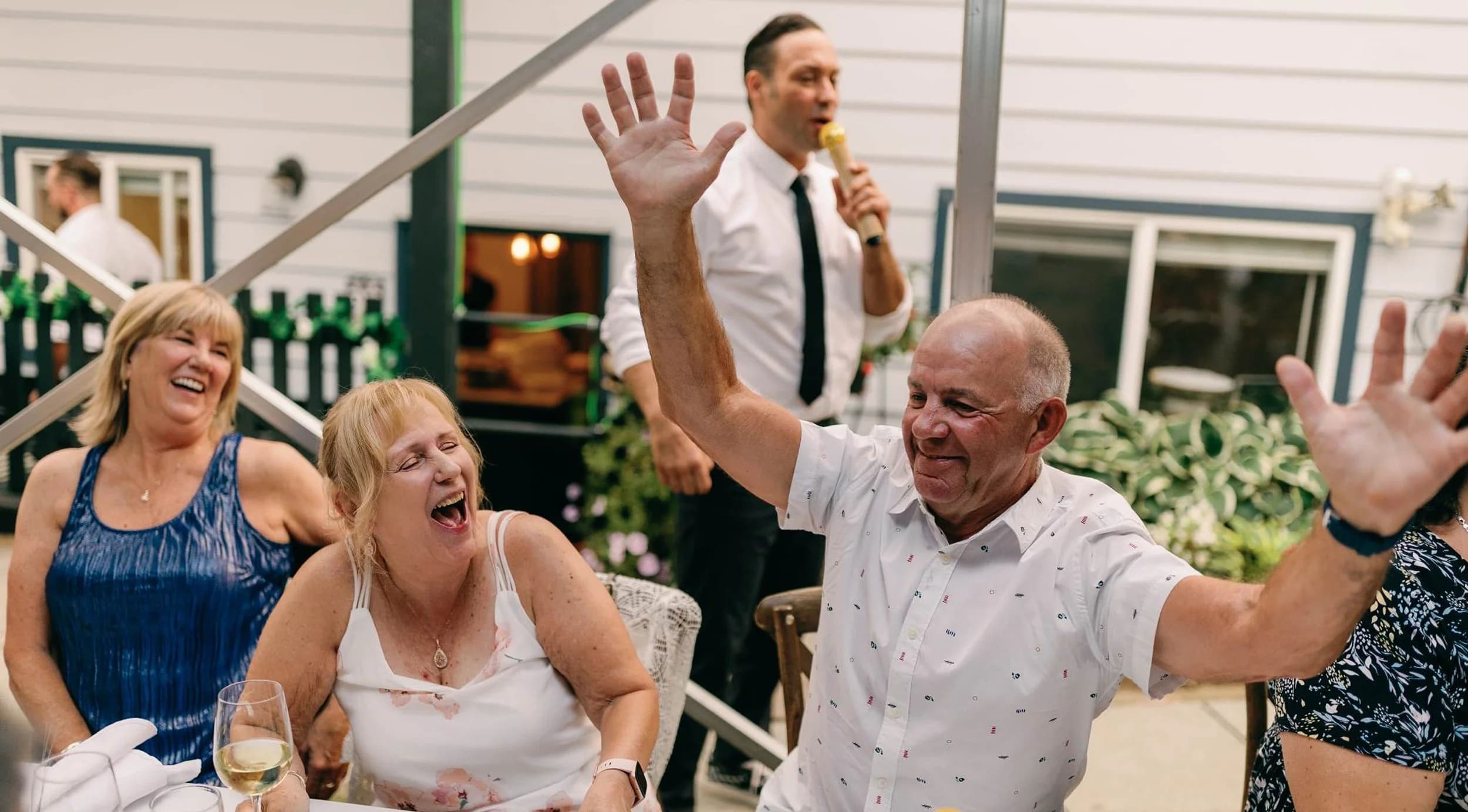 Guests laughing during a hosted reception