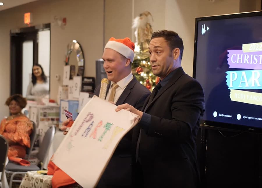 Mike Oulton hosting an interactive corporate holiday event in Vancouver